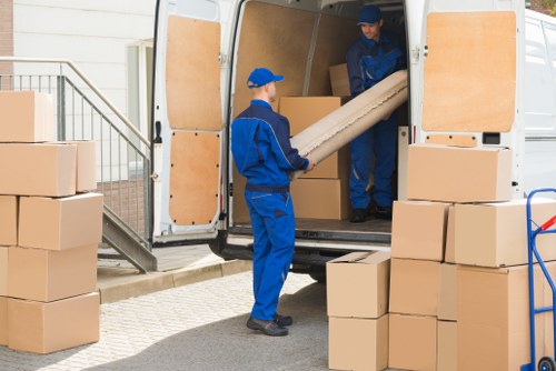 Removal truck and storage boxes for Westham moving services