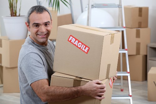 Packed moving boxes and protective wrapping for Westham removals