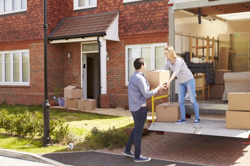 Preparation tips for flat removals in Westham with labelled moving boxes