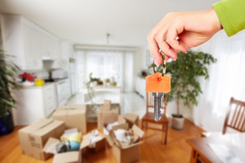 Apartment relocation service in Westham with packed boxes and moving van