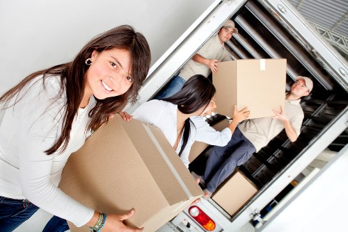 Professional movers handling furniture during a Westham relocation