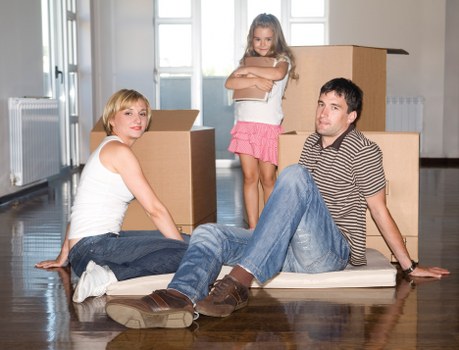 Packed moving boxes and furniture ready for Westham removals